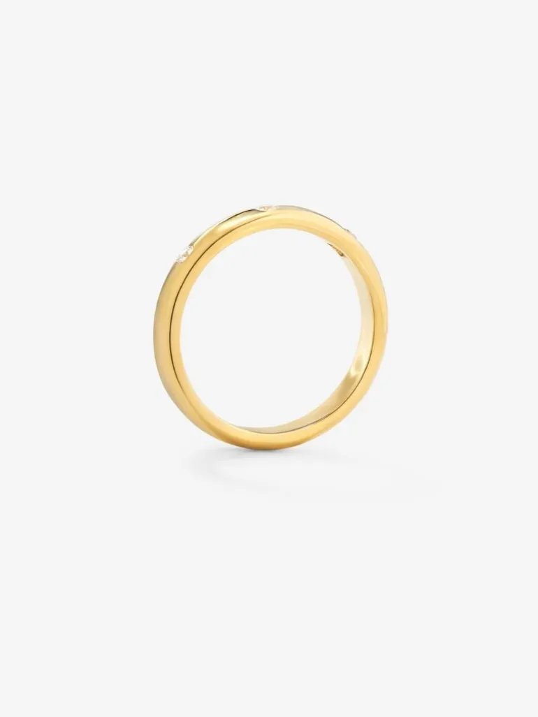 Alianza de oro amarillo de 18K con 3 diamantes en talla brillante con un total de 0,09 cts