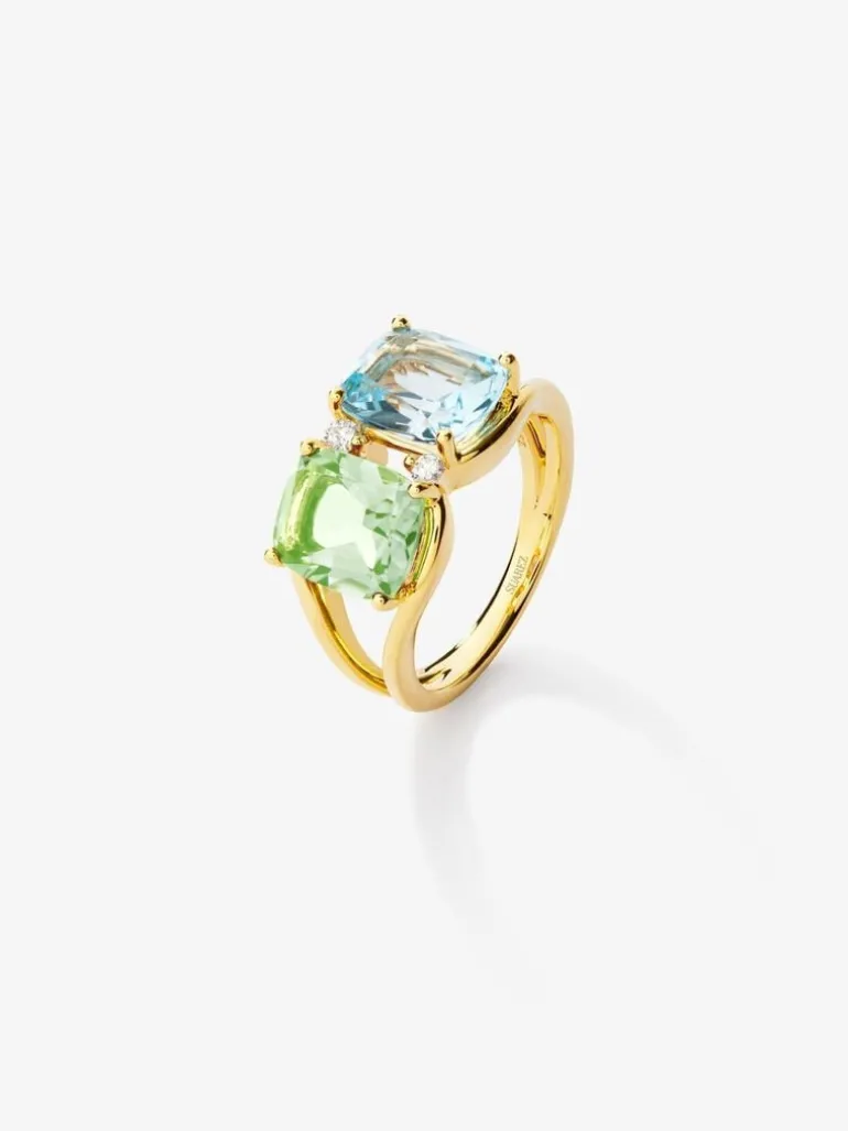 Anillo de oro amarillo de 18K con topacio azul sky en talla cushion de 2,75 cts, amatista verde en talla cushion de 2 cts y 2 diamantes en talla brillante con un total de 0,06 cts