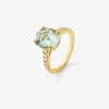 Anillo de oro amarillo de 18K con amatista verde en talla oval de 3,8 cts y 14 diamantes en talla brillante con un total de 0,32 cts