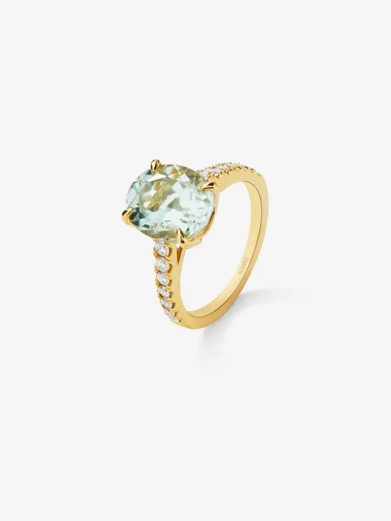Anillo de oro amarillo de 18K con amatista verde en talla oval de 3,8 cts y 14 diamantes en talla brillante con un total de 0,32 cts
