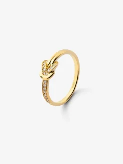 Anillo de oro amarillo de 18K con 15 diamantes en talla brillante con un total de 0,09 cts y forma de nudo