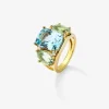 Anillo de oro amarillo de 18K con topacio azul sky en talla cushion de 5,5 cts, amatistas verdes en talla oval de 4,65 cts y diamantes blancos en talla brillante de 0,15 cts
