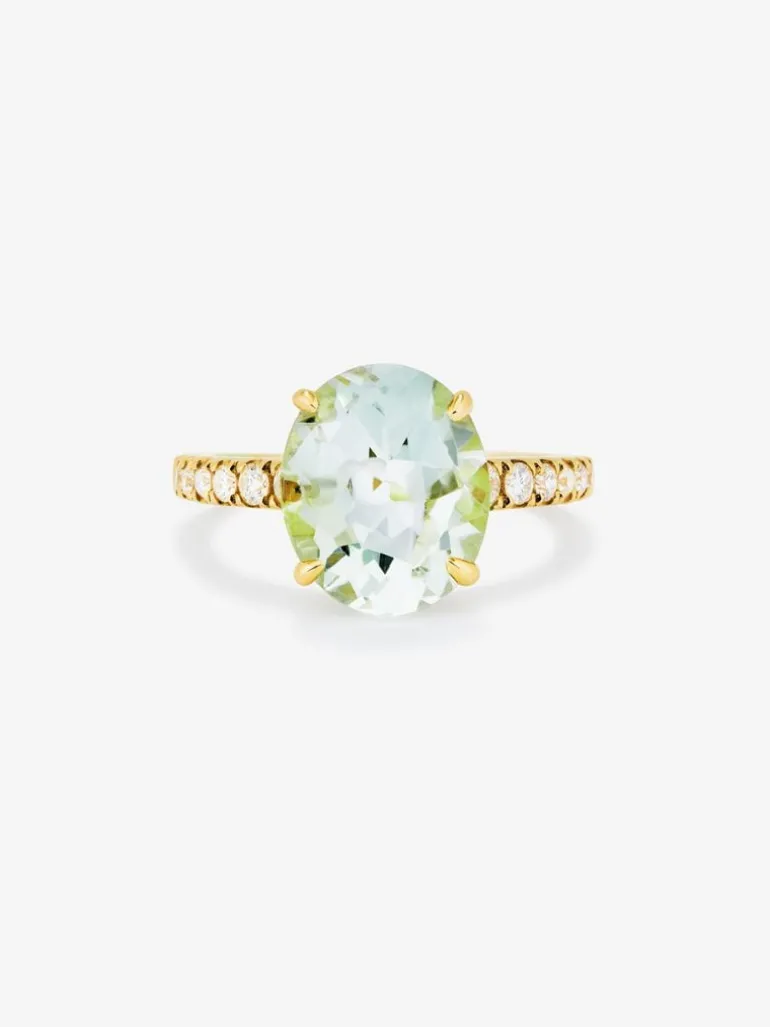 Anillo de oro amarillo de 18K con amatista verde en talla oval de 4,34 cts y 12 diamantes en talla brillante con un total de 0,29 cts