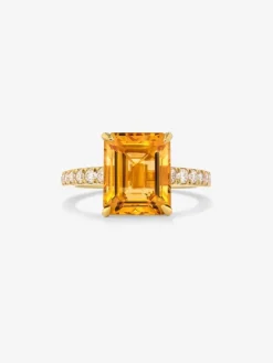 Anillo de oro amarillo de 18K con cuarzo citrino en talla radiant de 1,2 cts y 18 diamantes en talla brillante con un total de 0,18 cts