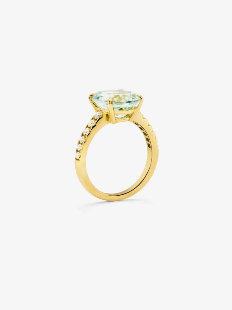 Anillo de oro amarillo de 18K con amatista verde en talla oval de 4,34 cts y 12 diamantes en talla brillante con un total de 0,29 cts