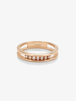 Anillo doble de oro rosa de 18K con 7 diamantes en talla brillante con un total de 0,1 cts
