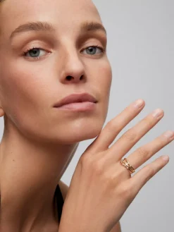 Anillo multibrazo de oro amarillo de 18K con 9 diamantes en talla brillante con un total de 0,08 cts