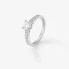 Anillo solitario de compromiso de oro blanco de 18K con diamantes