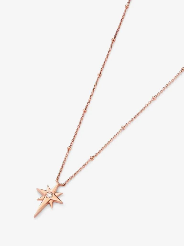 Colgante cadena con estrella de oro rosa de 18K con diamante