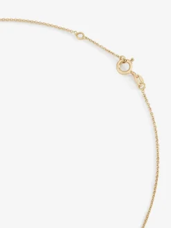 Colgante cadena cruz de oro rosa de 18K con turmalina y diamante