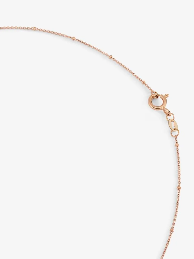 Colgante cadena largo con estrella de oro rosa de 18K con diamantes