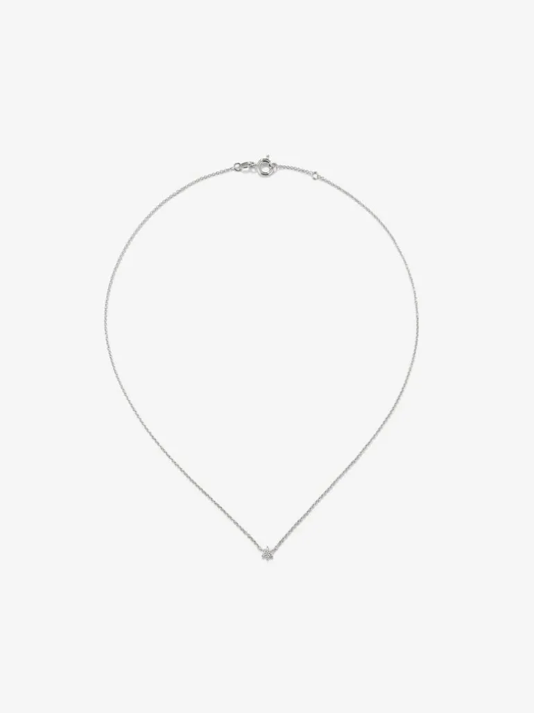 Colgante de oro blanco de 18K y diamantes en talla brillante de 0,08 cts y forma de estrella