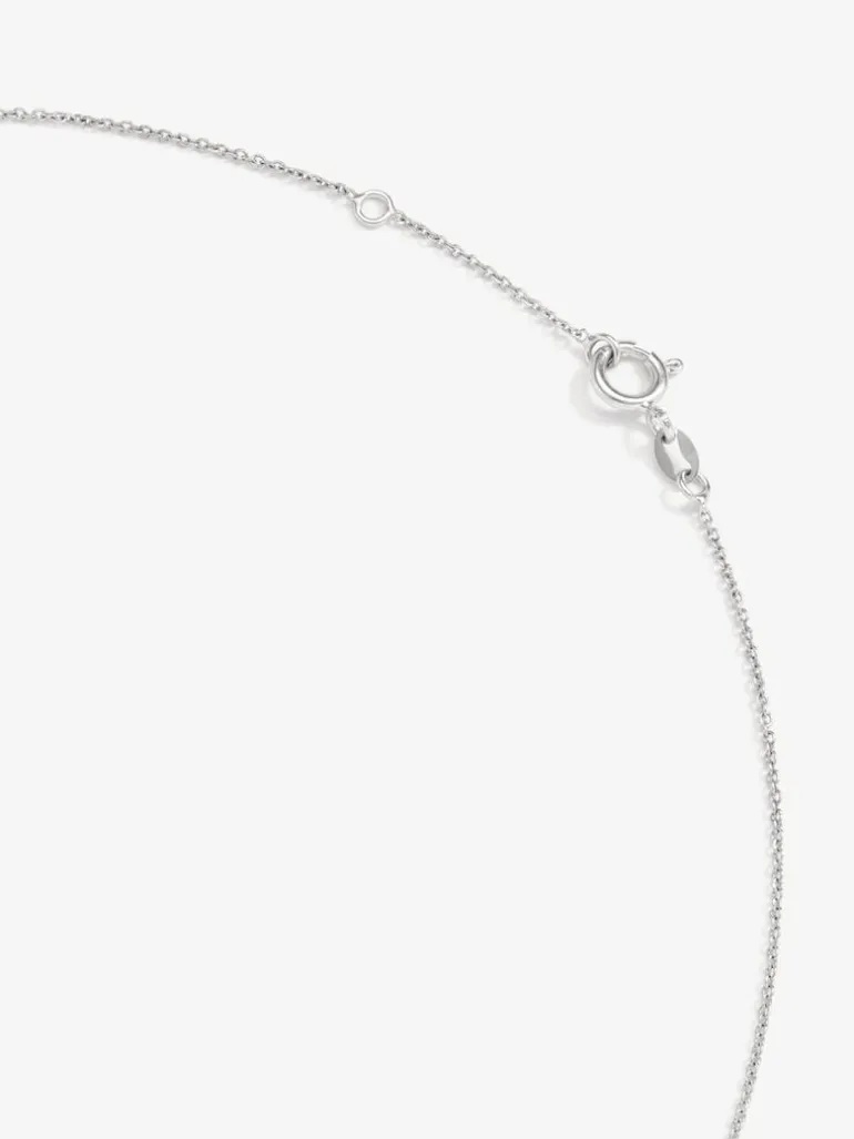 Colgante de oro blanco de 18K con rubí rojo intenso en talla pera de 0,88 cts y diamantes 0,48 cts