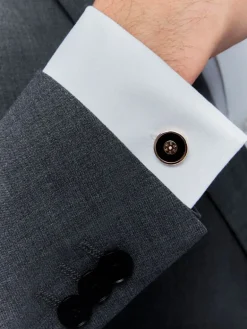 Gemelos de oro rosa de 18K con ónix negro y 2 diamantes en talla brillante con un total de 0,006 cts