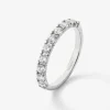 Media alianza de oro blanco de 18K con 10 diamantes en talla brillante con un total de 0,74 cts
