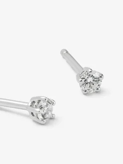 Pendientes de oro blanco de 18K con 2 diamantes en talla brillante con un total de 0,2 cts