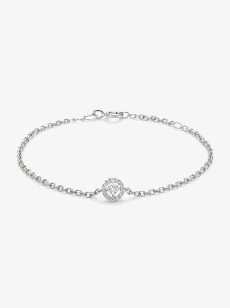 Pulsera cadena de oro blanco de 18K con diamante solitario y orla de diamantes