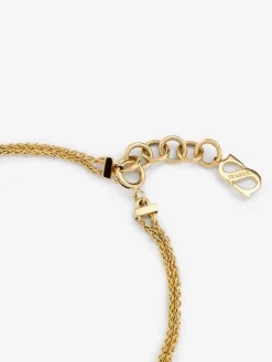 Pulsera de oro amarillo de 18K con 17 diamantes en talla brillante con un total de 0,15 cts y forma de nudo