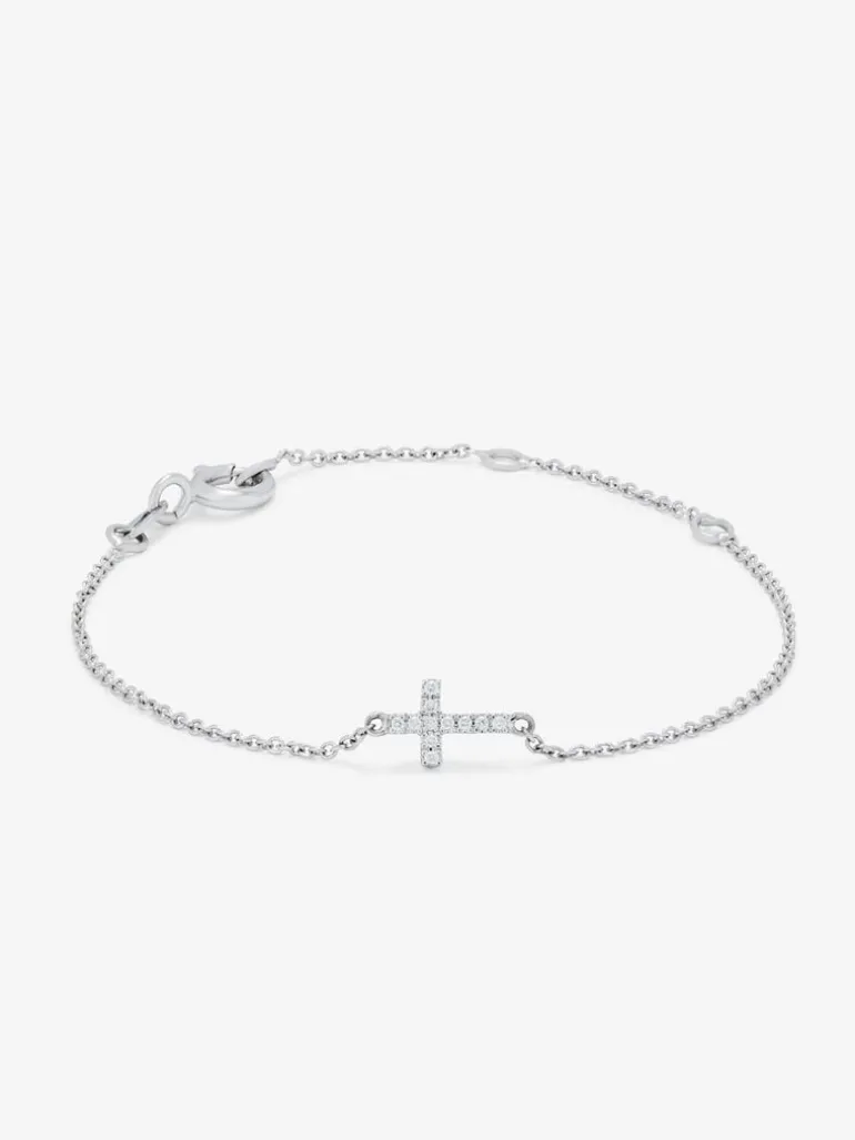 Pulsera de oro blanco de 18K con 11 diamantes en talla brillante con un total de 0,04 cts y cruz