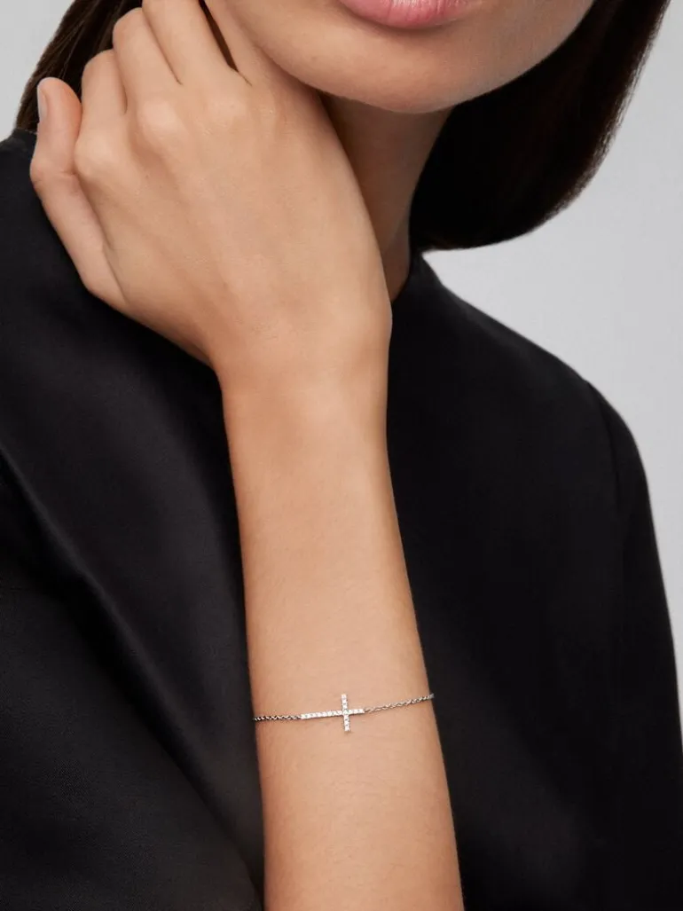 Pulsera de oro blanco de 18K con cruz de diamantes en talla brillante de 0,17 cts