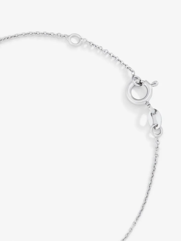 Pulsera de oro blanco de 18K con 11 diamantes en talla brillante con un total de 0,04 cts y cruz