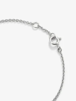 Pulsera de oro blanco de 18K con cruz de diamantes en talla brillante de 0,17 cts