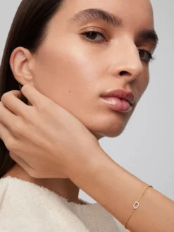 Pulsera de oro blanco y amarillo de 18K con diamantes blancos en talla brillante de 0,03 cts
