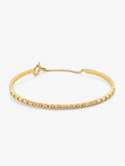 Pulsera rígida de oro amarillo de 18K con 21 diamantes en talla brillante con un total de 0,29 cts