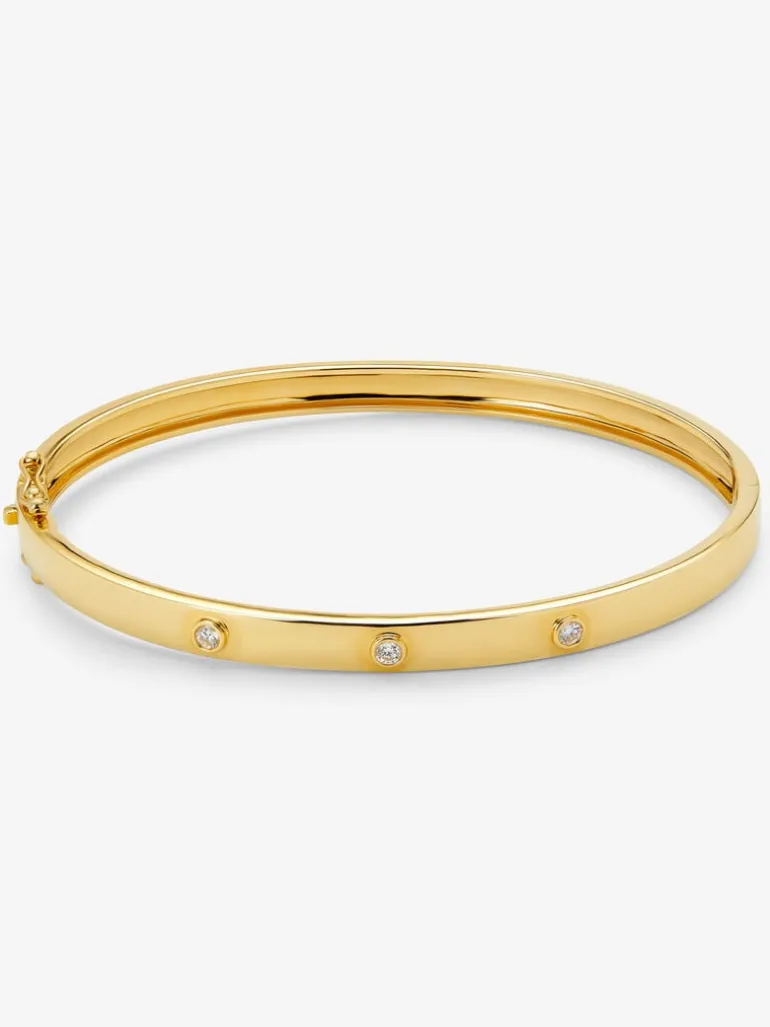Pulsera rígida de oro amarillo de 18K con diamantes blancos en talla brillante de 0,13 cts