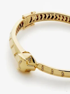 Pulsera rígida de oro amarillo de 18K con 61 diamantes en talla brillante con un total de 0,23 cts y forma de tigre