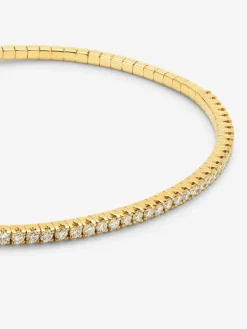Pulsera r&iacute;gida de oro amarillo de 18K con 42 diamantes en talla brillante con un total de 0,75 cts