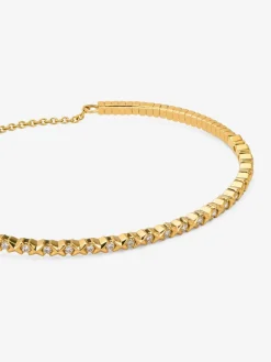 Pulsera r&iacute;gida de oro amarillo de 18K con 21 diamantes en talla brillante con un total de 0,29 cts