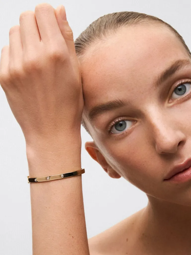 Pulsera rígida de oro amarillo de 18K con diamantes blancos en talla brillante de 0,13 cts