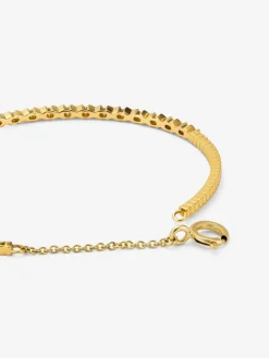 Pulsera r&iacute;gida de oro amarillo de 18K con 21 diamantes en talla brillante con un total de 0,29 cts