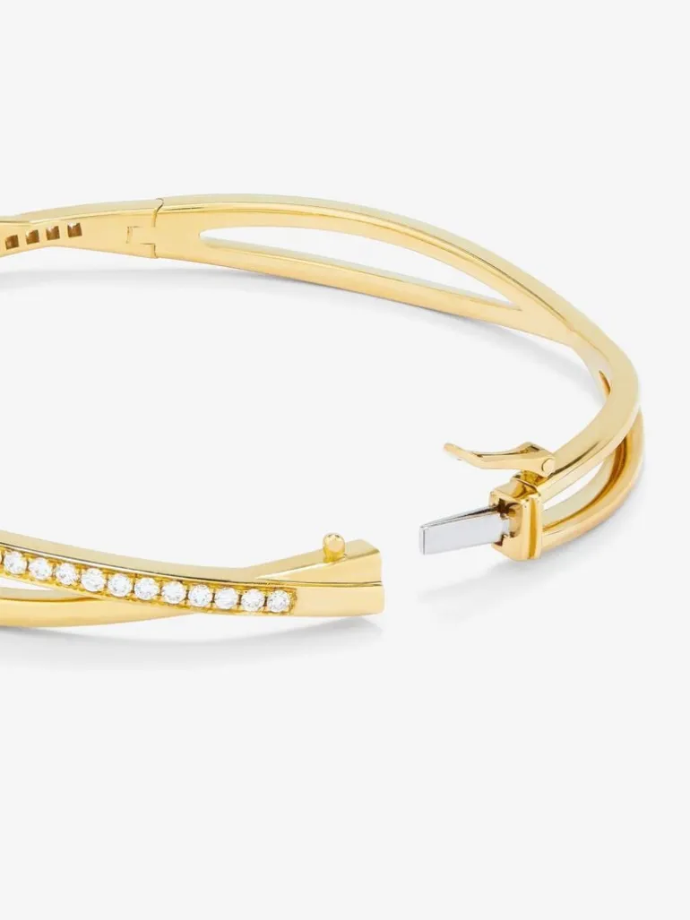 Pulsera rígida de oro amarillo de 18K con diamantes blancos en talla brillante de 0,74 cts